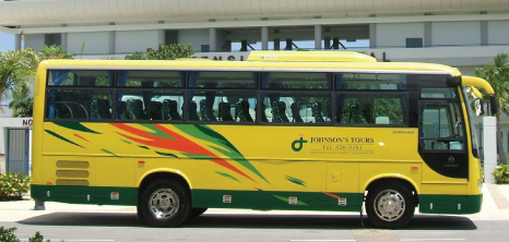 A Johnson's Tours Bus Waiting on Passengers Outside Kensington Oval, Bridgetown, Barbados Pocket Guide