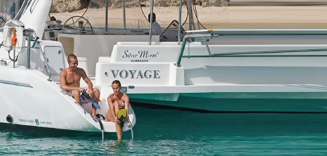 Couple Getting Ready to Swim with the Turtles, Silver Moon Luxury Catamarans, Barbados Pocket Guide