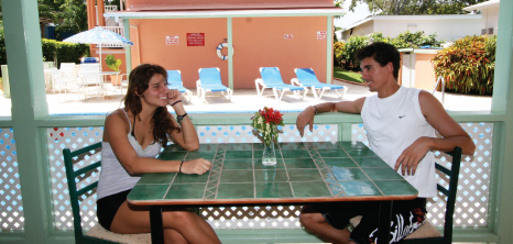 Couple Awaiting Their Meal at Worthing Court Apartment Hotel, Barbados Pocket Guide