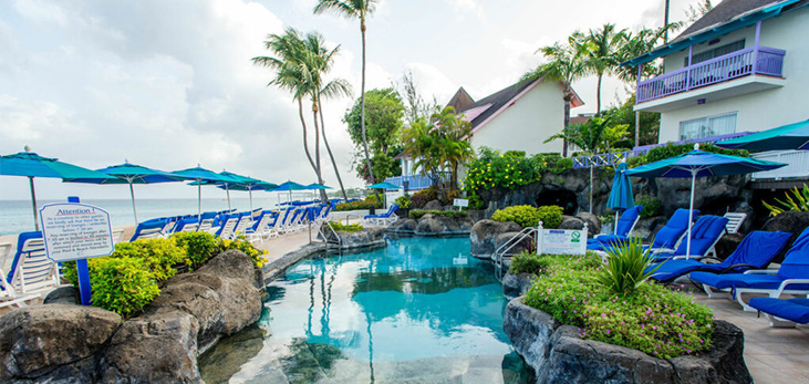 Couple Relaxing Under the Waterfall at Crystal Cove Hotel, Appleby, St. James, Barbados Pocket Guide