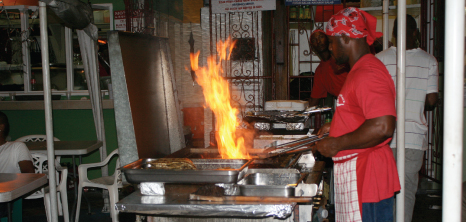 Chef Frying Fish Outdoors at Oistins Fish Fry, Oistins, Christ Church, Barbados Pocket Guide