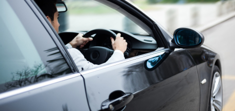 Driver on the road in his automobile