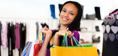 Female with shopping bags in fashion store