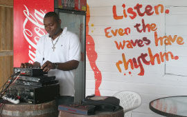 A DJ Plays Music at Copacabana Beach Bar & Grill, Bay Strret, St. Michael, Barbados Pocket Guide