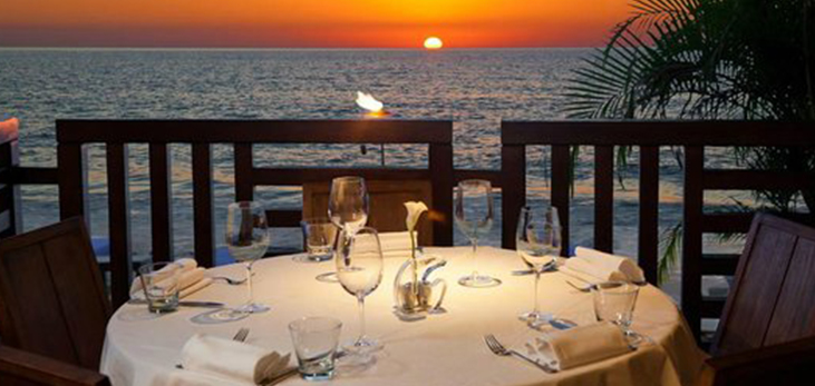 Dinner Tables Overlooking the Sea, Daphnes Restaurant, Paynes Bay, St. James, Barbados Pocket Guide