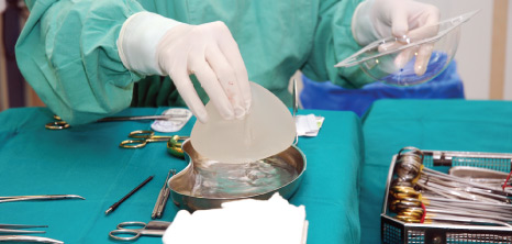 Plastic surgeon preparing for surgery