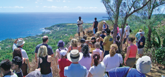 An Island Safari Tour Guide Educating Guests about Barbados