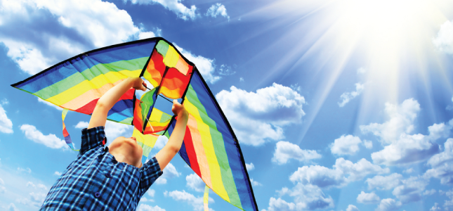 Young boy flying a kite