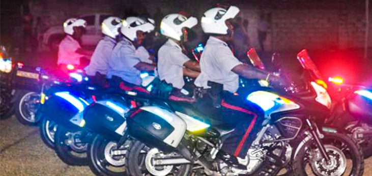 Police Patrolling the Streets of Green Hill, St. Michael on Kadooment Day, Barbados Pocket Guide
