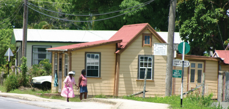 Lady Walking Through a Village to take her Grandmother to Church, Barbados Pocket Guide