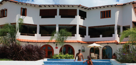 Visitors Enjoying the Pool at Sugar Cane Club Hotel, Maynards, St. Peter, Barbados Pocket Guide