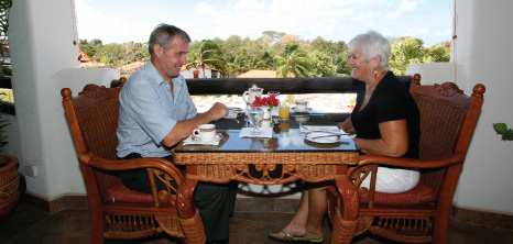 Couple Having Coffee at La Salsa Restaurant, Sugar Cane Club, St. Peter, Barbados Pocket Guide