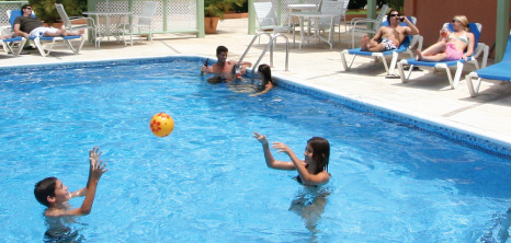 Children Playing in a Pool, Barbados Pocket Guide