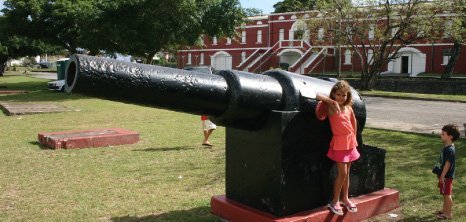 Two Children Standing Next to a Canon at the Historic Garrison, St. Michael, Barbados Pocket Guide