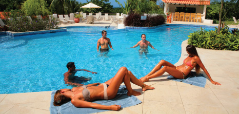 Visitors to a Hotel Relaxing in the Pool, Barbados Pocket Guide
