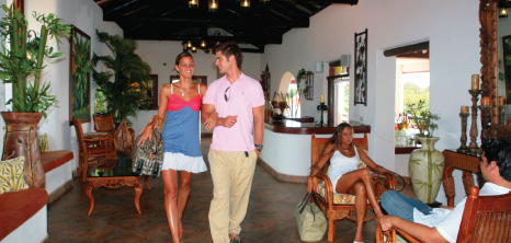 Couple Walking Through the Lobby at Sugarcane Club Hotel & Spa, St. Peter, Barbados Pocket Guide